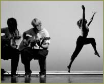 Photo of a dancer and two musicians.