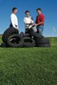 Photo of researchers surrounded by tires on a golf course.