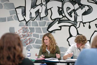 Photo of the Writing Fellows' classroom with a mural in the background.