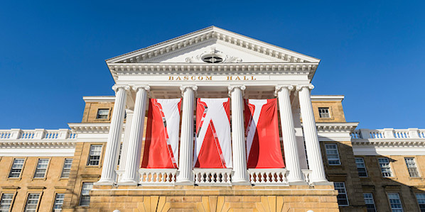 W banners hang from the columns of Bascom Hall.
