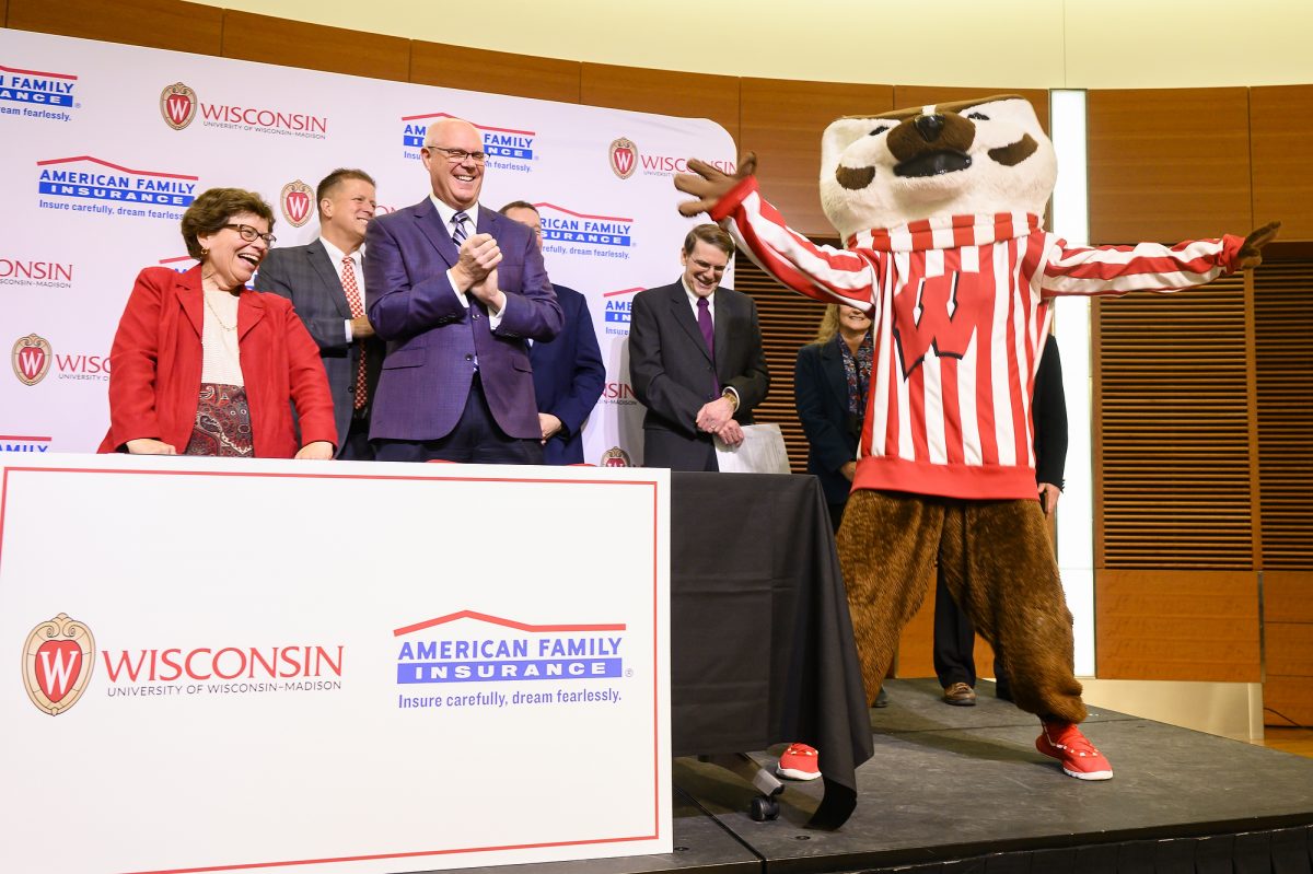 UW Chancellor Rebecca Blank and Jack Salzwedel, Chairman and CEO of American Family Insurance, are joined by UW mascot Bucky Badger after they sign a letter of intent during the University of Wisconsin-Madison and American Family Insurance Partnership Celebration Event held in the Discovery Building of the University of Wisconsin-Madison on April 19, 2019. During the event, American Family Insurance announced that it was significantly expanding its support of the university by establishing a new American Family Insurance Data Science Institute. (Photo by Bryce Richter / University of Wisconsin-Madison)