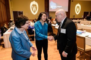 Chancellor Blank and UW System President Ray Cross greet student Isabel Markowski