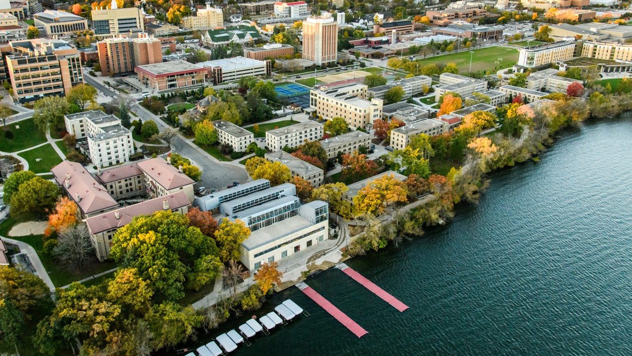 This slide is an aerial shot of the UW–Madison campus, shown with Lake Mendota and Porter Boathouse in the foreground