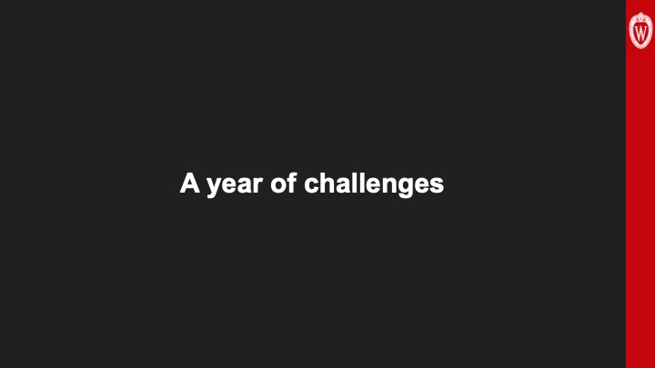 Slide 2: Against a black background, white text reads, “A year of challenges.”