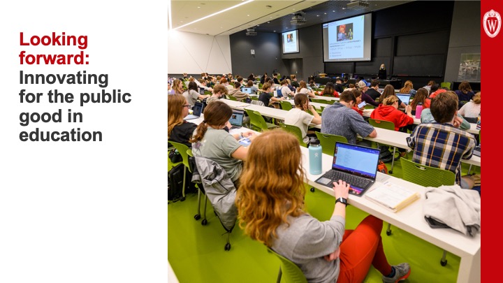 Slide 22: Text reads, “Looking forward: Innovating for the public good in education” to the left of a photo of students seated in rows in a large, interactive lecture hall.