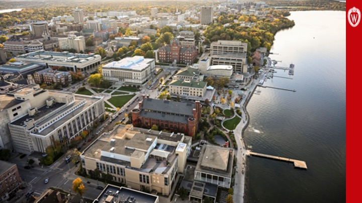 Slide 33: An aerial photo of the UW–Madison campus shows campus buildings to the left and Lake Mendota to the right.