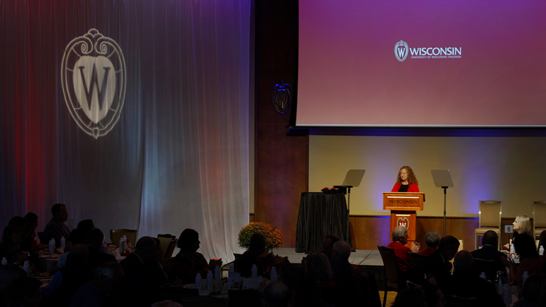 Image of Chancellor Mnookin speaking in Varsity Hall at the 2024 Lunch with the Chancellor board of visitors event