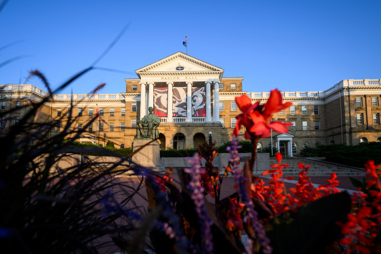 Flowers in foreground with Bascom Hall set in background.