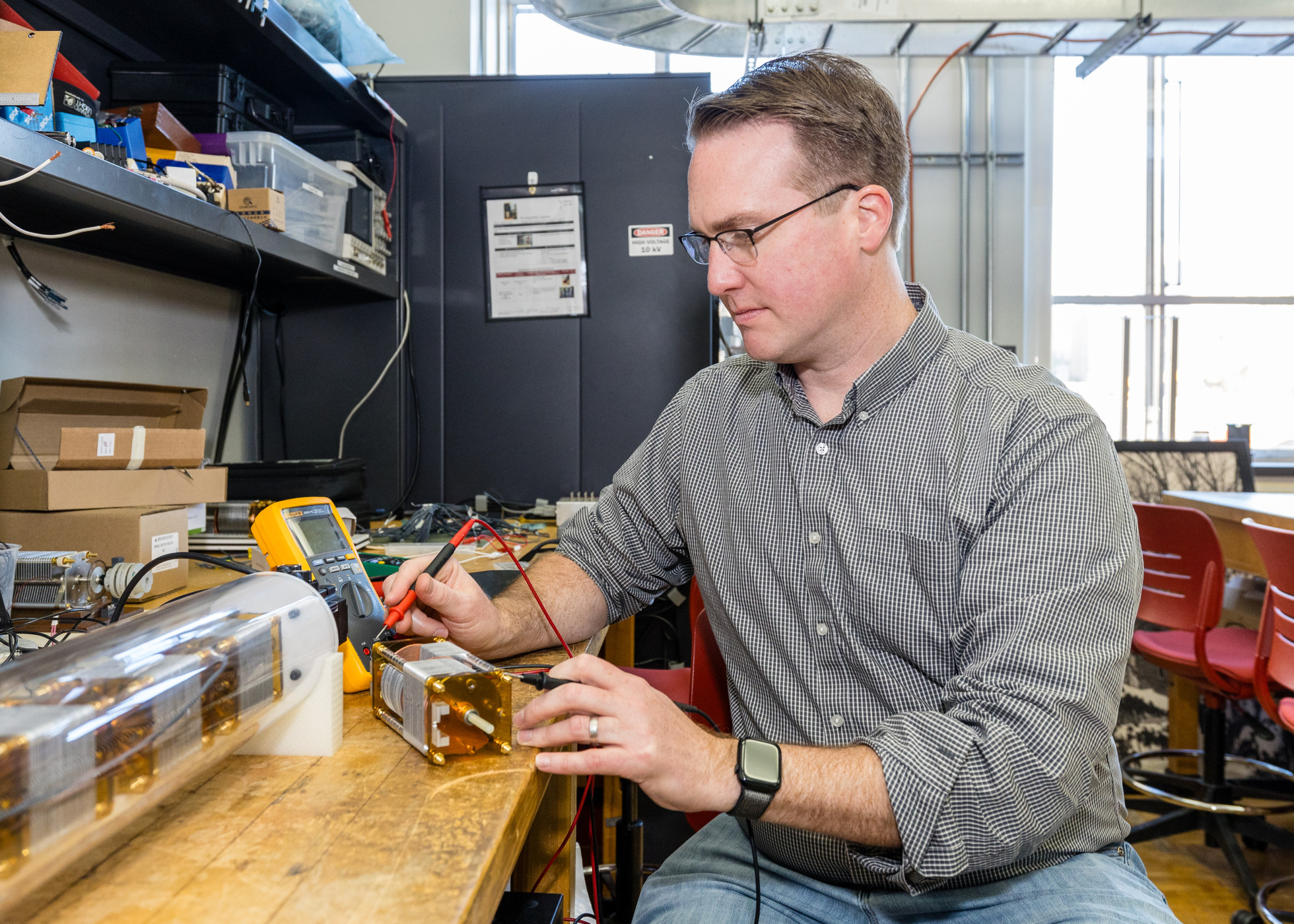 Dan Ludois, a professor of electrical and computer engineering in the College of Engineering, works in his lab.
