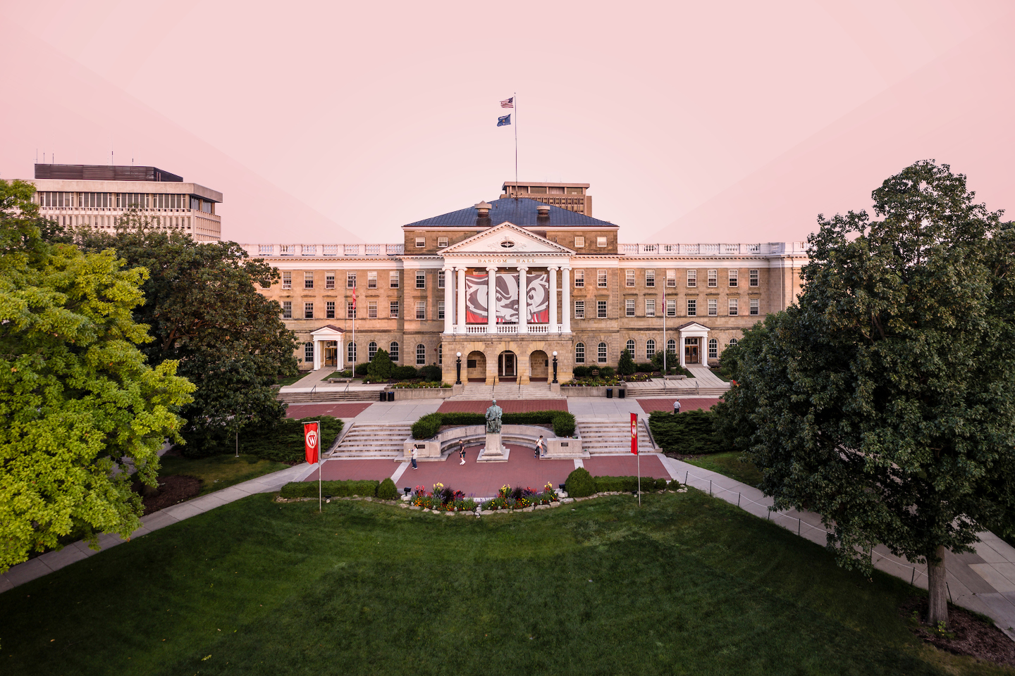 Bascom Hall is pictured with a light pink hue overlay.